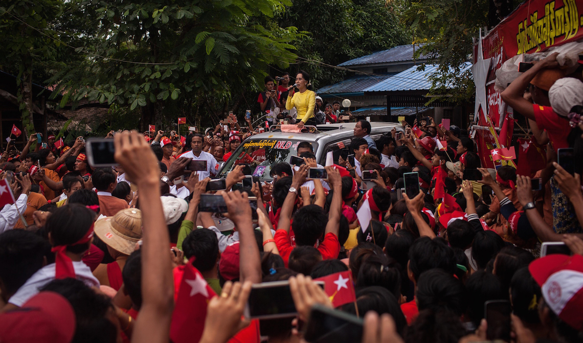 KAWHMU, MYANMAR - OCTOBER 24:  Aung Sun Suu Kyi, leader of Myanmar's National League for Democracy Party, campaigns in her constituency on October 24, 2015 in Kawhmu, Myanmar. Suu Kyi has been the parlimentary representative of Kawhmu since the 2012 bi-elections and has created new roads and a hospitality training school to increase prosperity in the constituency. Myanmar's elections are scheduled for November 8, 2015 and will be the fairest in the country's history.  (Photo by Lauren DeCicca/Getty Images)